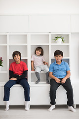 Image showing young boys posing on a shelf