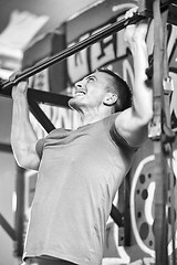 Image showing man doing pull ups