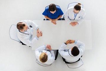 Image showing group of doctors sitting at empty table