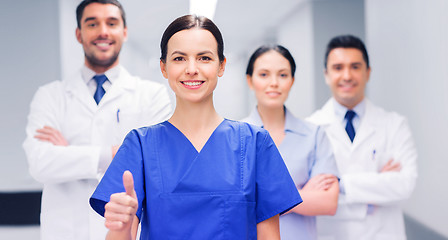 Image showing medics or doctors at hospital showing thumbs up