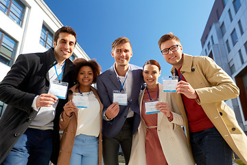 Image showing business team with conference badges in city