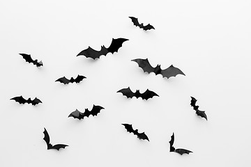 Image showing black paper bats over white background