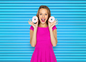 Image showing happy woman or teen girl with donuts