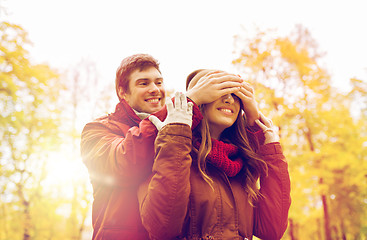 Image showing happy young couple having fun in autumn park