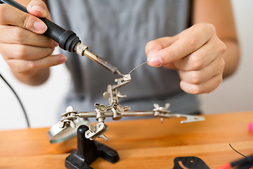 Image showing Welding the flying drone at home