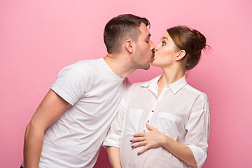 Image showing The funny handsome man and his beautiful pregnant wife