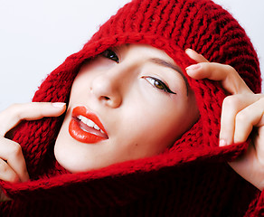 Image showing young pretty woman in sweater and scarf all over her face