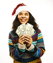 Image showing cute young girl in santas red hat with money isolated