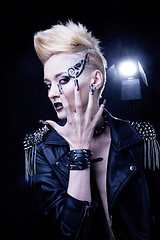 Image showing Fashion Rocker Style Model Girl Portrait. Hairstyle. Rocker or Punk Woman Makeup, Hairdo and black Nails. Smoky Eyes in studio