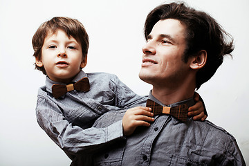 Image showing father with son in bowties on white background, casual look