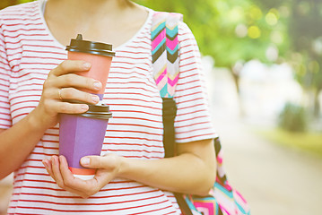 Image showing Take-away coffee in his hands.