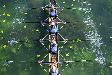 Image showing Ladies fours rowing team in race on the lake