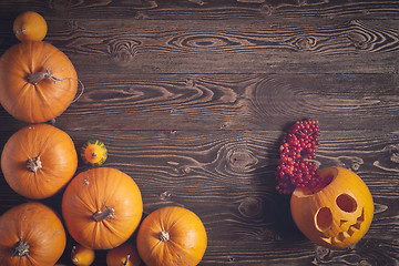 Image showing Halloween pumpkins over wooden background