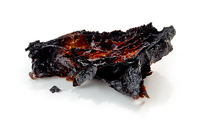 Image showing burned croissant on a white background