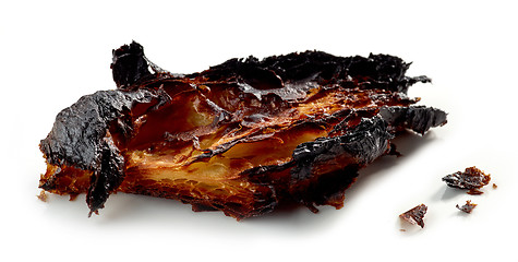 Image showing burned croissant on a white background