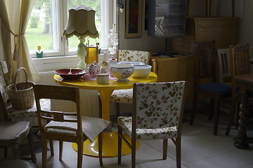 Image showing small cozy room filled with furniture and utensils