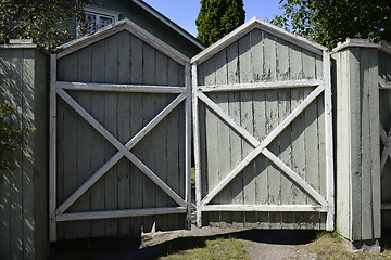 Image showing old wooden gate with cracked paint