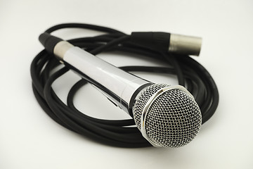 Image showing vintage microphone with wire on white