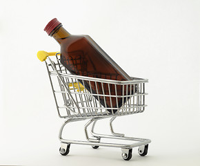 Image showing bottle in a shopping trolley