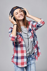 Image showing Teen girl listening enjoying music