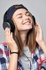 Image showing Teen girl listening enjoying music