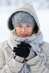 Image showing Portrait of lady outdoor in snow in cold winter time.