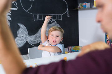 Image showing Cute little toddler boy at child therapy session.