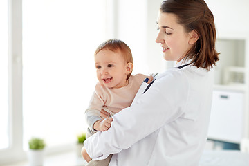 Image showing doctor or pediatrician holding baby at clinic