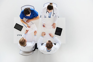 Image showing group of doctors with cardiograms at hospital