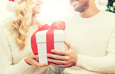 Image showing close up of couple with christmas gift at home