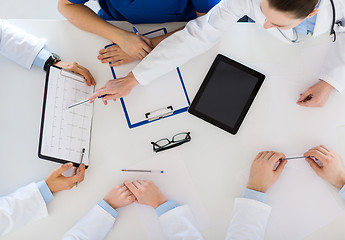 Image showing doctors with cardiogram and tablet pc at hospital