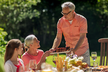 Image showing happy family having dinner or summer garden party