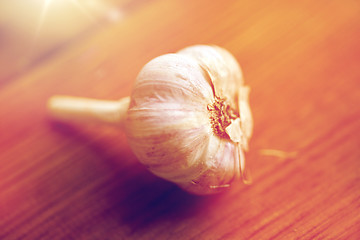 Image showing close up of garlic on wooden table