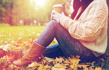 Image showing close up of  woman drinking coffee in autumn park