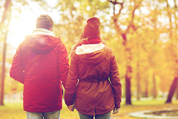 Image showing happy young couple walking in autumn park