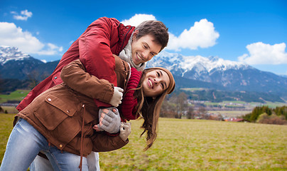 Image showing happy young couple having fun over alps mountains