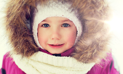 Image showing face of happy little kid or girl in winter clothes