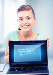 Image showing woman with laptop computer and virtual screen