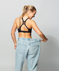 Image showing young slim sporty woman in oversize pants