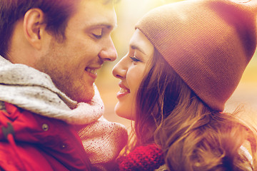 Image showing close up of happy young couple kissing outdoors