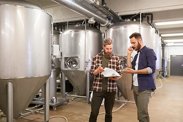 Image showing men working at craft brewery or beer plant