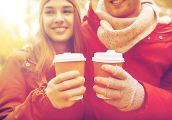 Image showing close up of happy couple with coffee in autumn