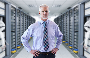 Image showing Senior businessman in server room