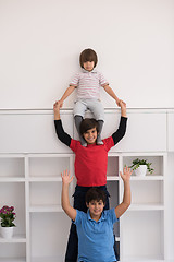 Image showing young boys posing line up piggyback