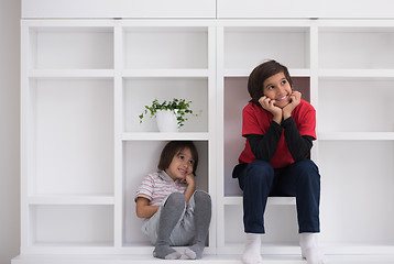 Image showing young boys posing on a shelf