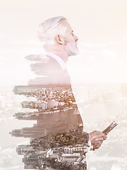 Image showing Double exposure of senior businessman