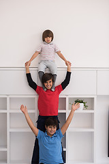 Image showing young boys posing line up piggyback