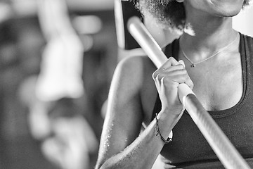 Image showing black woman after workout with hammer