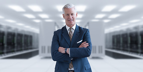 Image showing Senior businessman in server room