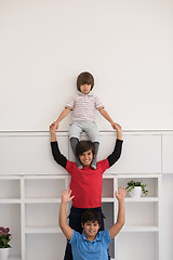 Image showing young boys posing line up piggyback